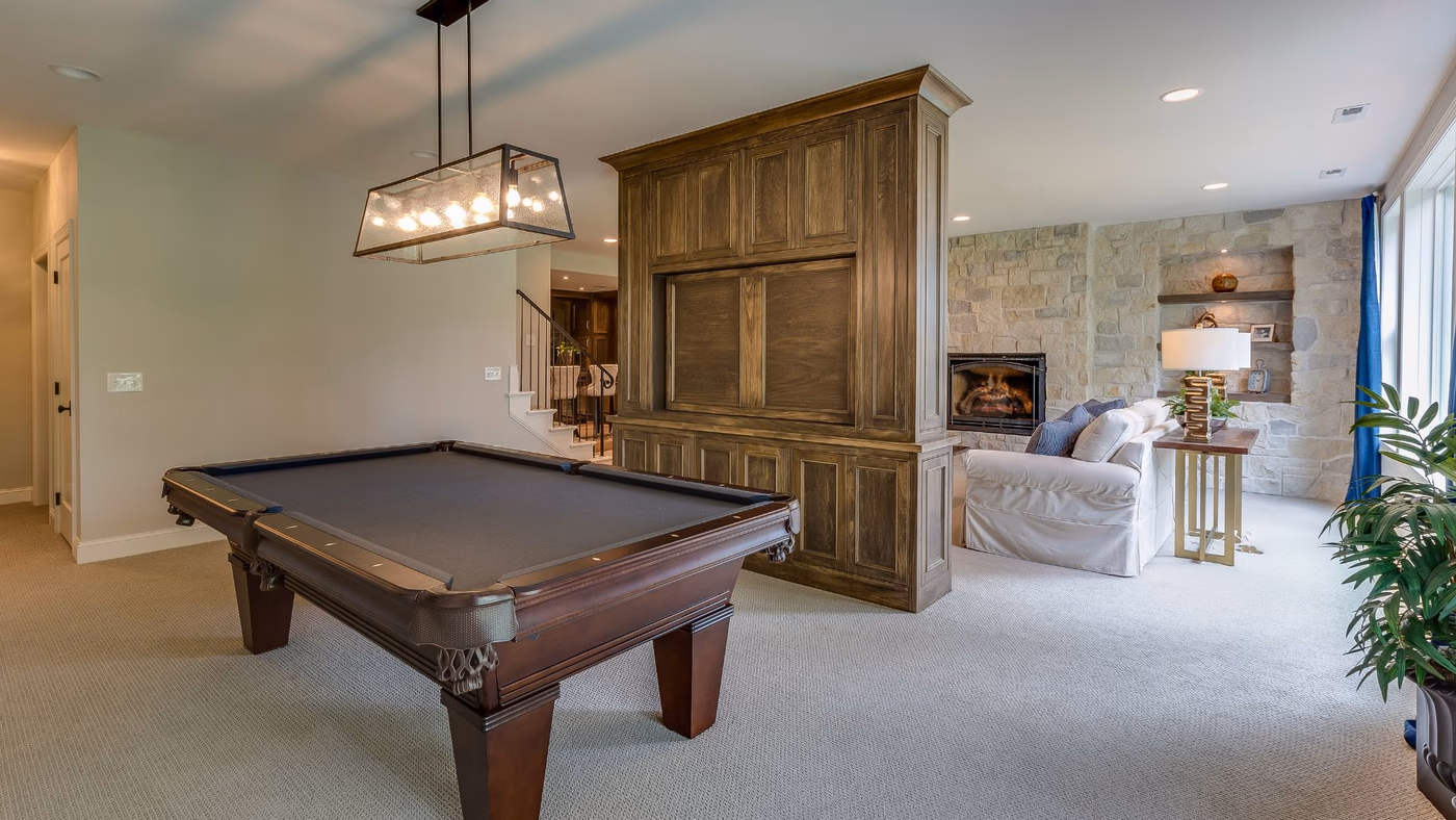 Luxury basement with pool table and fireplace